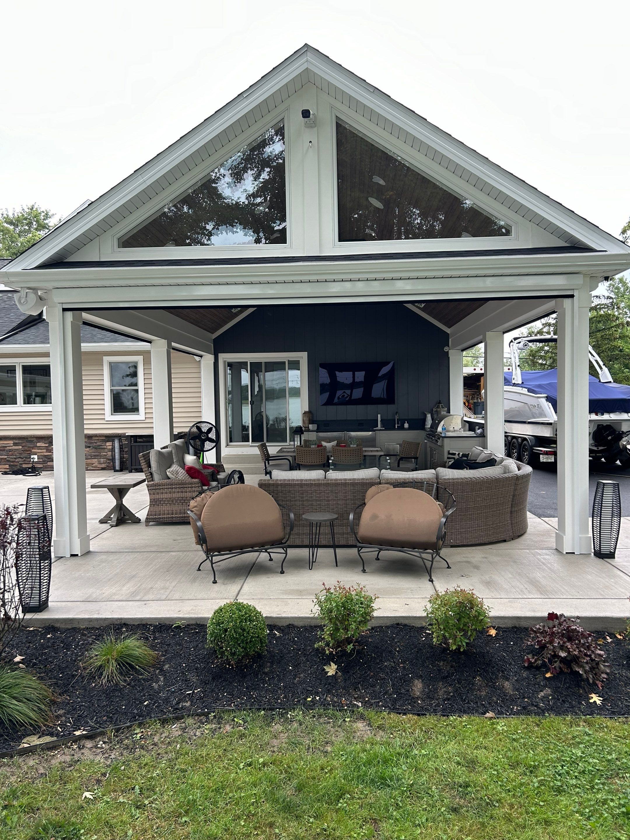 Backyard deck and exterior transition between a Buffalo home and its addition.