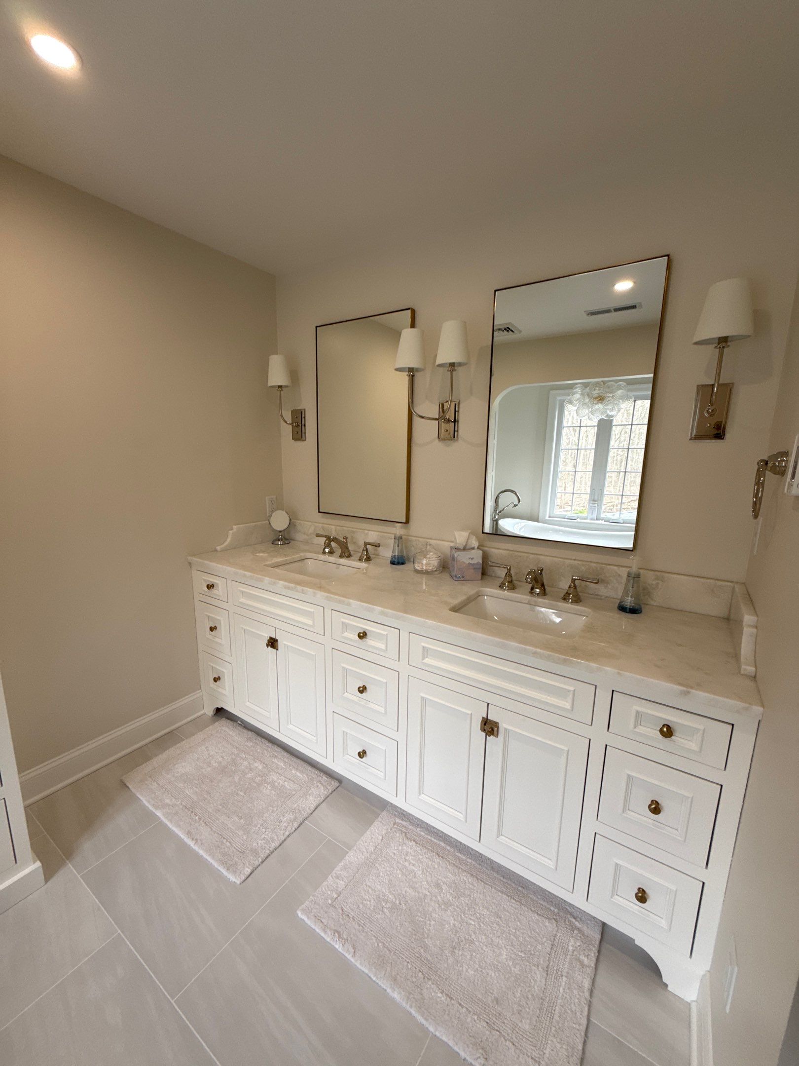 Updated bathroom with tiled shower and modern vanity in a Buffalo home remodel.